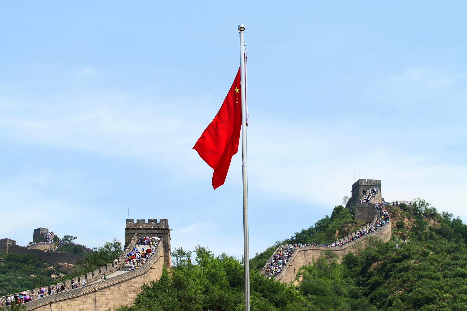 A scenic view of the Great Wall of China with the Chinese national flag in Beijing.