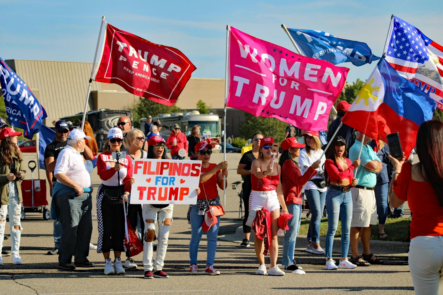 A group of diverse supporters at a political rally in Michigan.