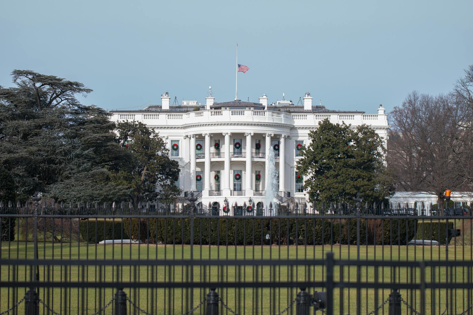 The White House in Washington, DC, USA, a symbol of American government, adorned with winter decorations.