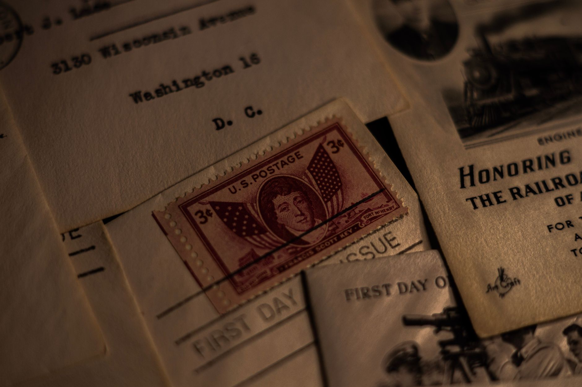 Close-up of a vintage U.S. postage stamp on an old letter with historical details.