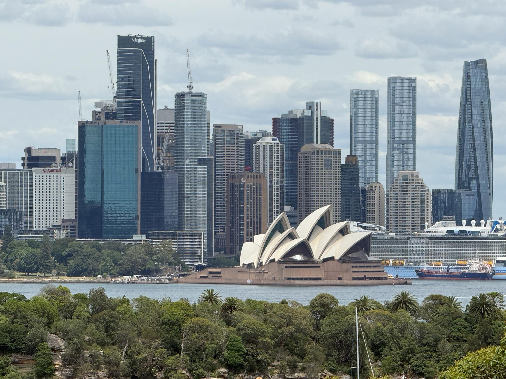 Scenic view of the Sydney Opera House with Sydney skyline in the background.