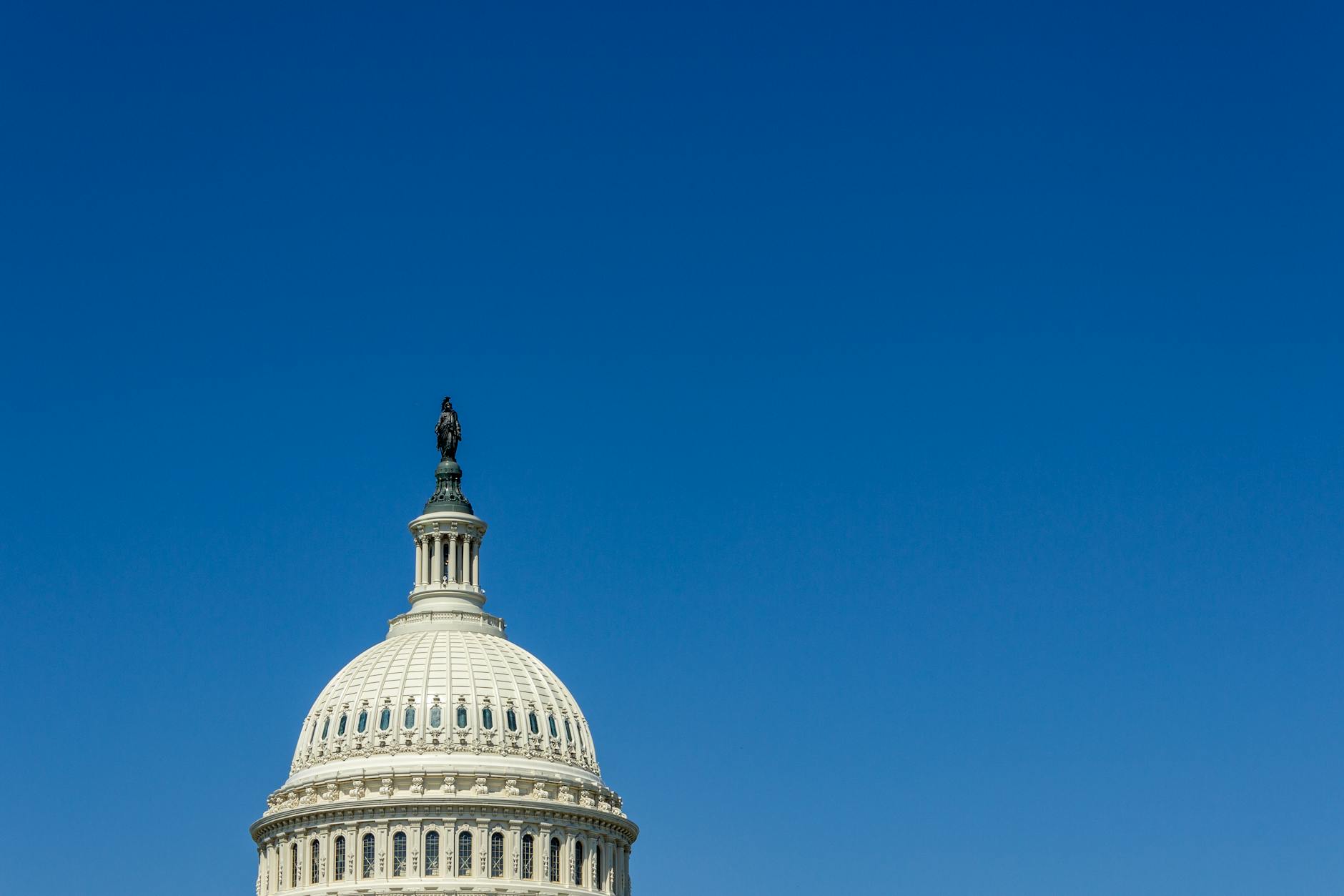 Congress Beshear satire image: Stunning view of the US Capitol Dome in Washington, DC, with clear blue sky.