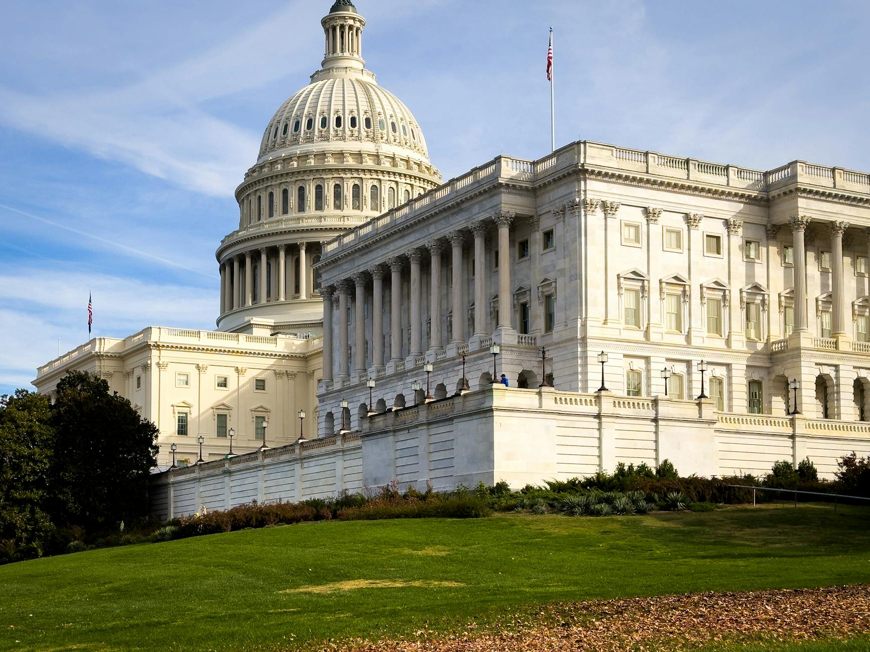 Trump Senate satire image: A picturesque view of the US Capitol Building in Washington, DC, under a clear sky.