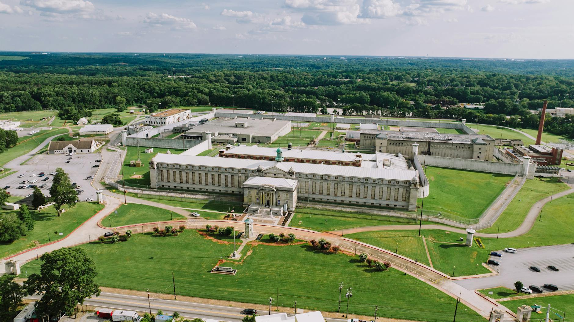 satire-image-30 Supreme Court Approves satire image: Aerial shot of the Atlanta Penitentiary with lush surroundings on a sunny day.