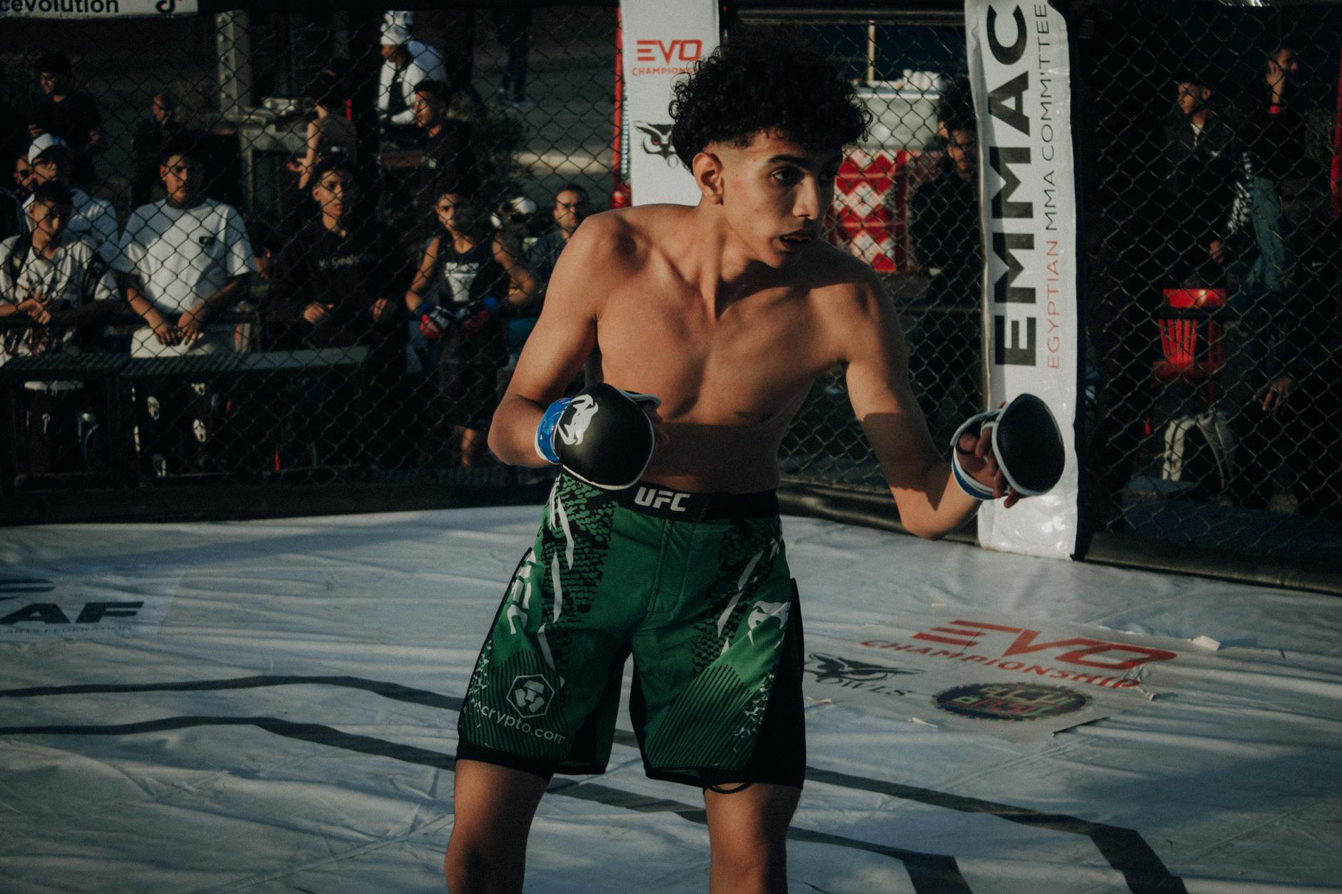Trump Creates satire image: Young male fighter in action during an MMA fight in a cage.