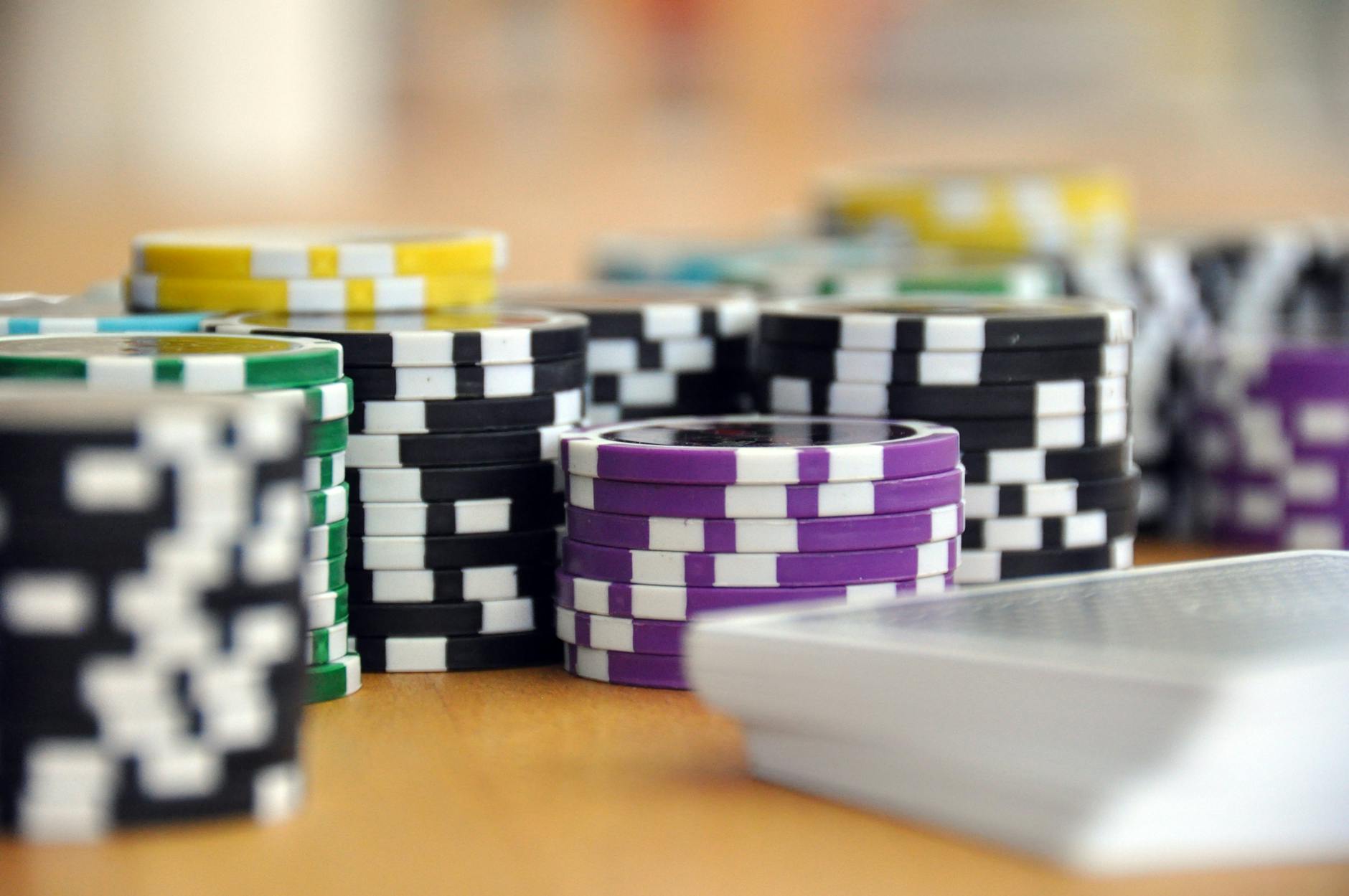 satire-image-36 Congress Senate satire image: A close-up shot of stacked poker chips and playing cards on a table, perfect for casino and gambling themes.