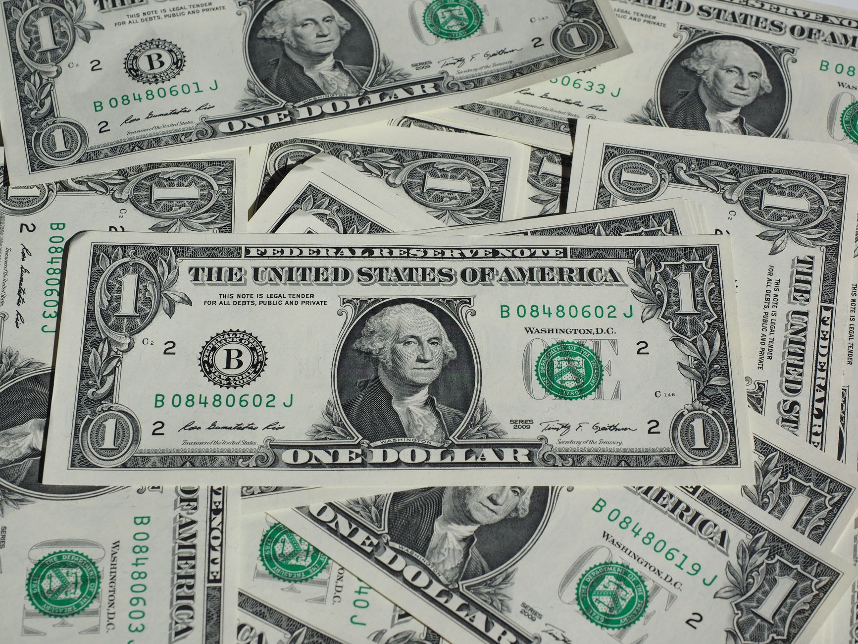 satire-image-59 White House Orders satire image: A detailed shot of a pile of U.S. one-dollar bills showcasing currency and finance concepts.