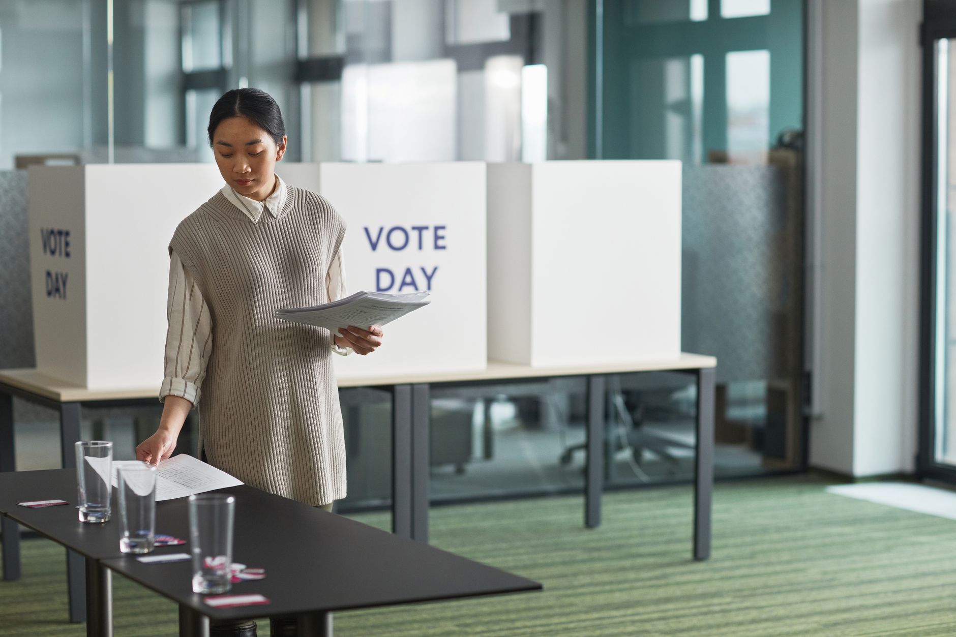 satire-image-62 Congress Georgia satire image: Asian woman preparing voting materials on election day.