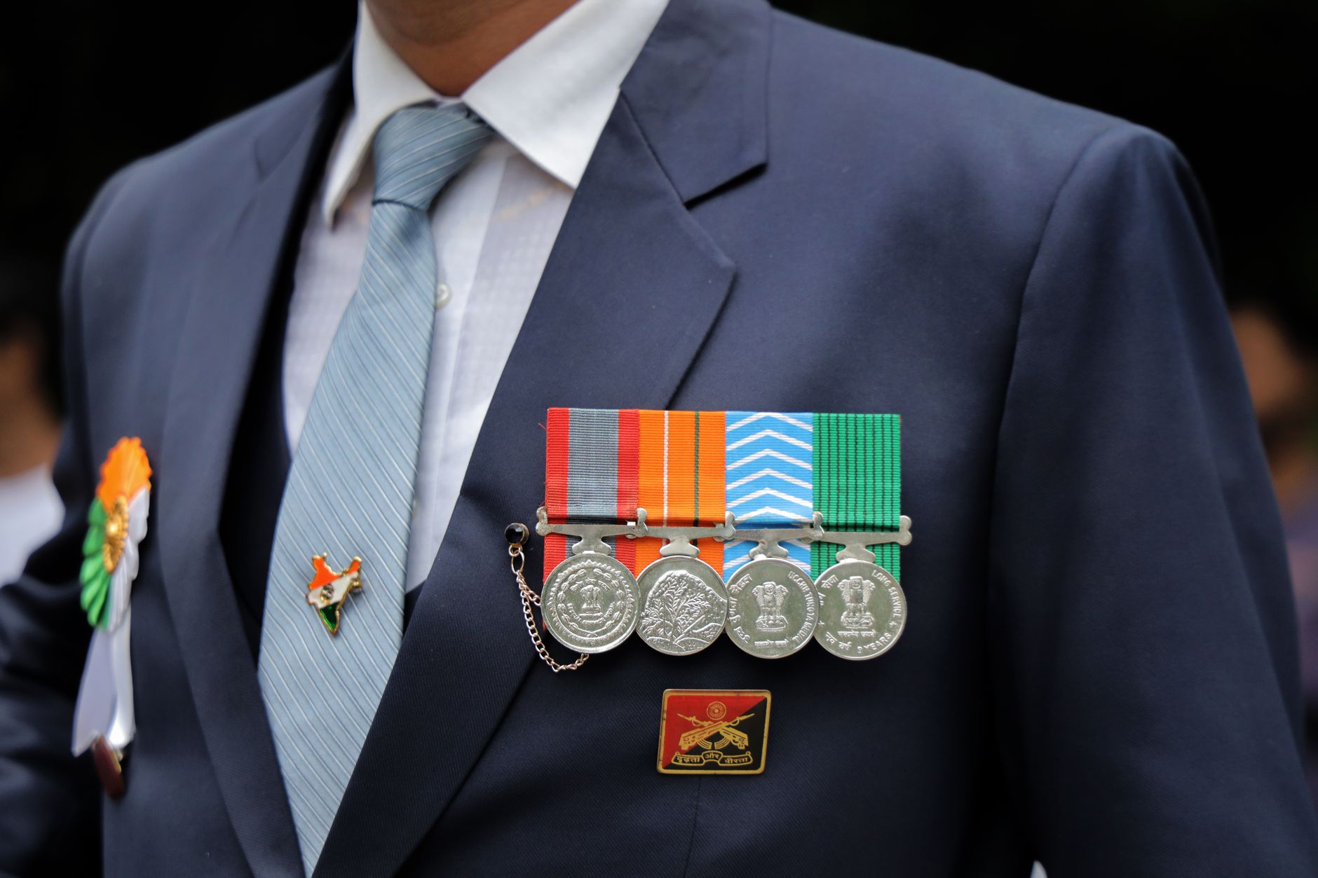satire-image-73 Trump Classifies satire image: Close-up of an Indian military ceremonial uniform with medals and Indian flag pin