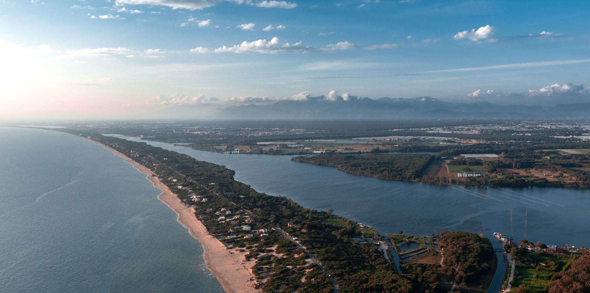 Trump Orders satire image: Aerial shot of a tranquil coastal landscape with lush countryside.